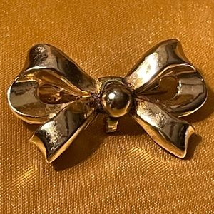 Vintage Coro gold colored bow pin with dangling hook